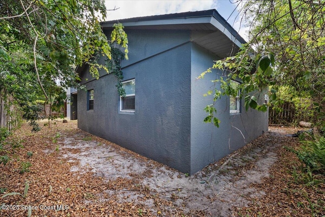 512 Palmetto Dr, Melbourne, FL 32935 - view of home's exterior featuring stucco siding