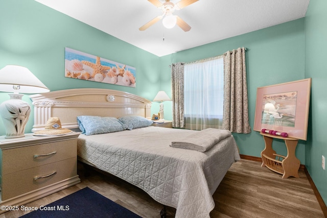550 E Merrimac Dr, Merritt Island, FL 32952 - bedroom with wood finished floors, baseboards, and ceiling fan