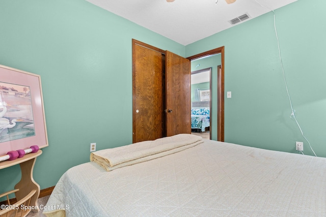 550 E Merrimac Dr, Merritt Island, FL 32952 - bedroom featuring baseboards, ceiling fan, a closet, and visible vents