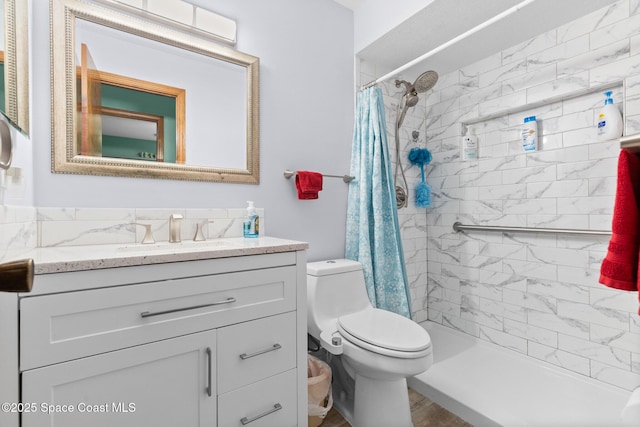 550 E Merrimac Dr, Merritt Island, FL 32952 - full bath with a stall shower, vanity, and toilet