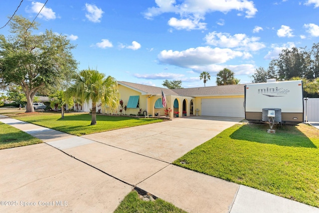 550 E Merrimac Dr, Merritt Island, FL 32952 - view of front facade with concrete driveway, a front yard, stucco siding, and an attached garage