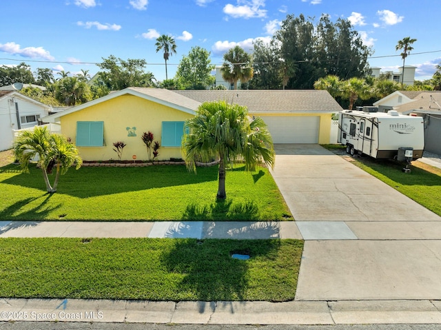 550 E Merrimac Dr, Merritt Island, FL 32952 - ranch-style home with concrete driveway, stucco siding, and a front lawn