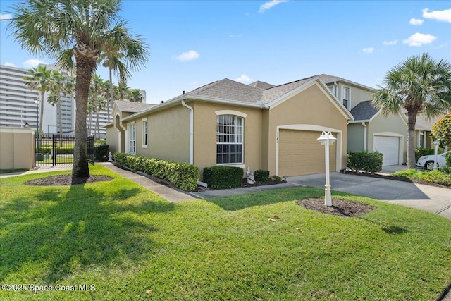 view of front of home with driveway, an attached garage, and stucco siding