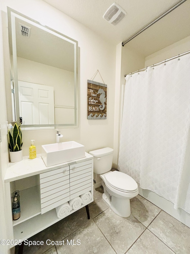 full bath with vanity, tile patterned flooring, toilet, and visible vents