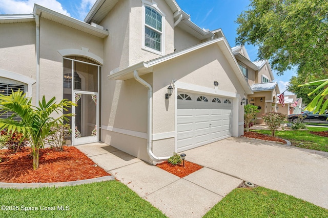 1050 Olde Bailey Ln, Melbourne, FL 32904 - view of front facade featuring stucco siding and driveway
