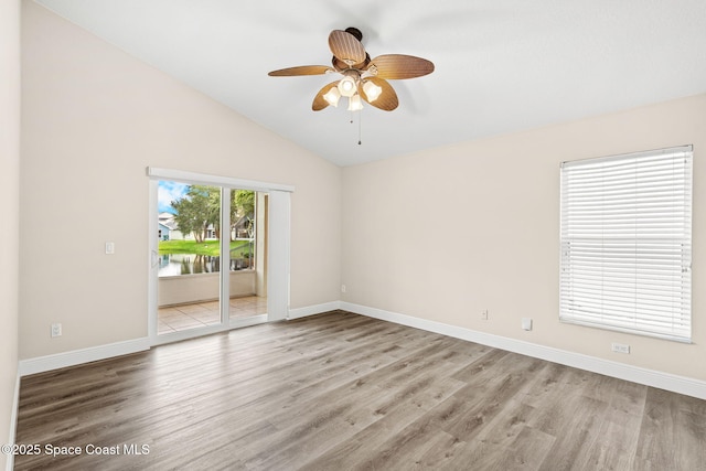 1050 Olde Bailey Ln, Melbourne, FL 32904 - unfurnished room featuring wood finished floors, baseboards, and lofted ceiling