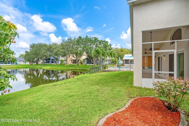 1050 Olde Bailey Ln, Melbourne, FL 32904 - view of yard featuring a water view, ceiling fan, and a sunroom