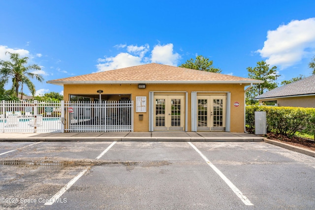 1050 Olde Bailey Ln, Melbourne, FL 32904 - view of property featuring uncovered parking and a community pool