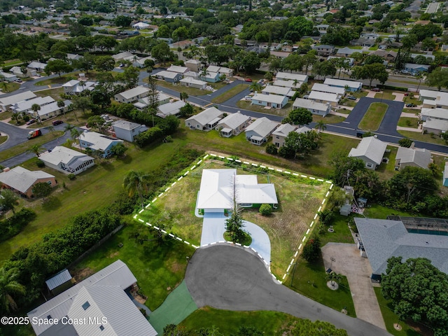aerial view of property and surrounding area with nearby suburban area