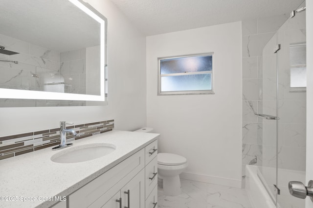 bathroom featuring marble look tiles, toilet, backsplash, baseboards, and vanity