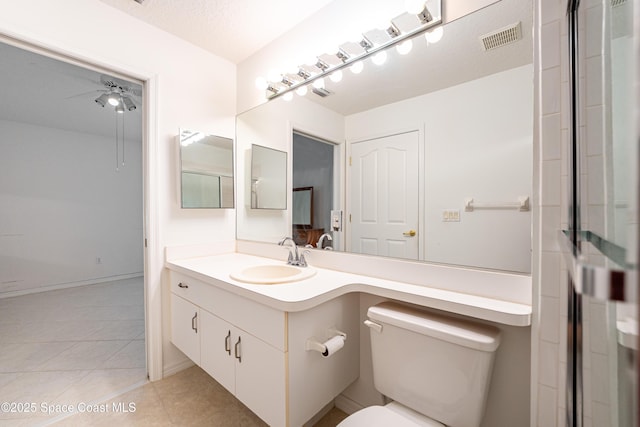 bathroom with tile patterned floors, vanity, toilet, and visible vents