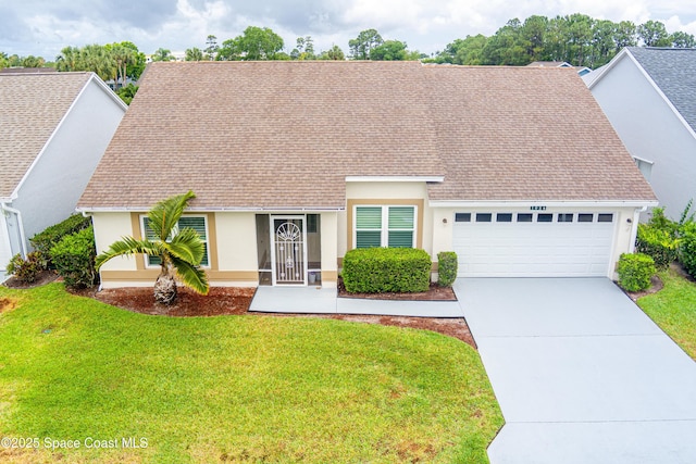 view of front of home with a garage, stucco siding, driveway, and a front yard