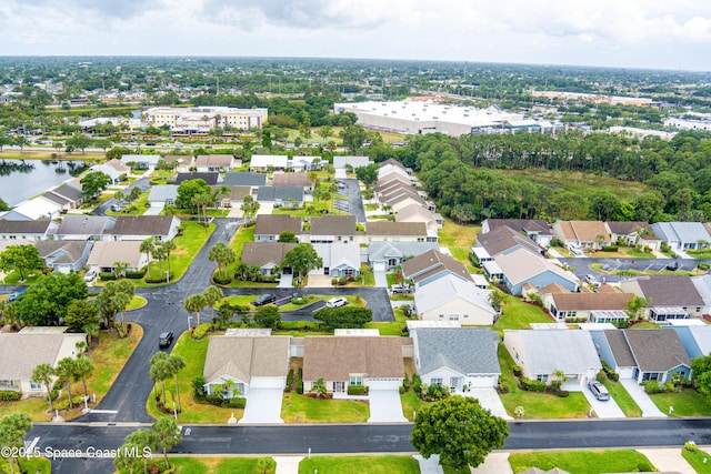 bird's eye view with a water view and a residential view