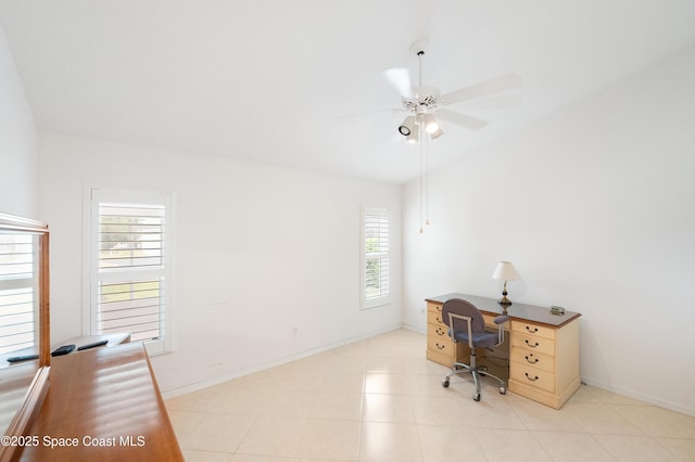 office featuring baseboards, ceiling fan, and vaulted ceiling
