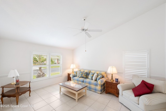 living room featuring baseboards, a ceiling fan, light tile patterned floors, and high vaulted ceiling