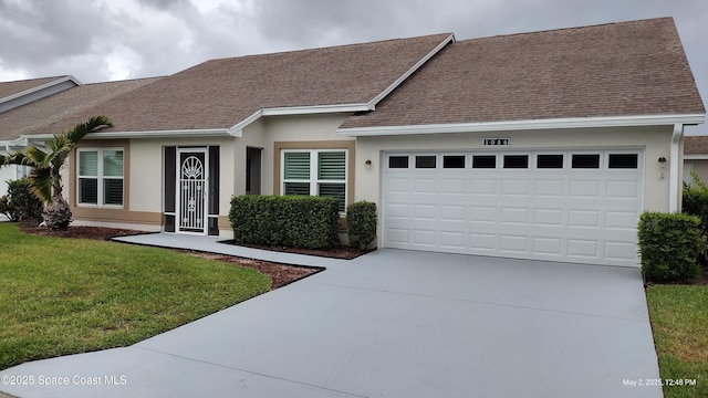 ranch-style house with a front lawn, roof with shingles, stucco siding, an attached garage, and driveway