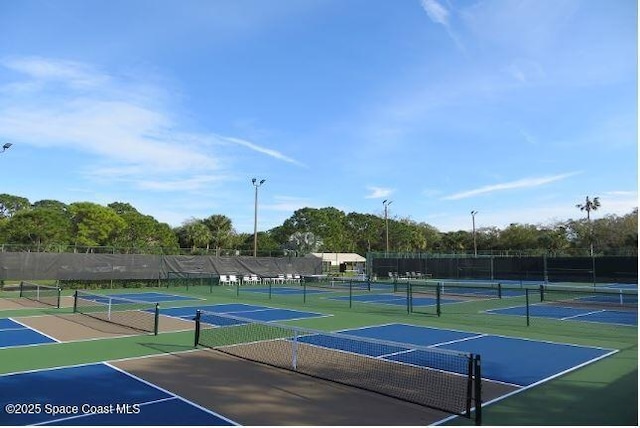 view of sport court featuring community basketball court and fence