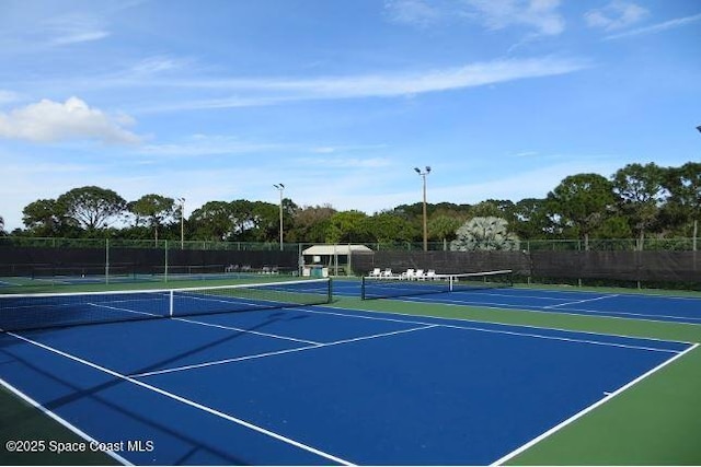 view of sport court featuring community basketball court and fence