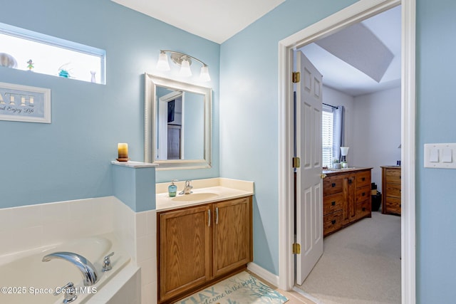 full bath with a garden tub and vanity