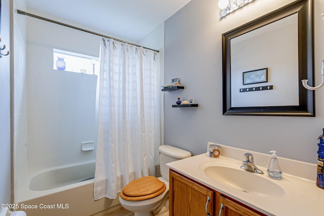 bathroom with toilet, vanity, and shower / bathtub combination with curtain