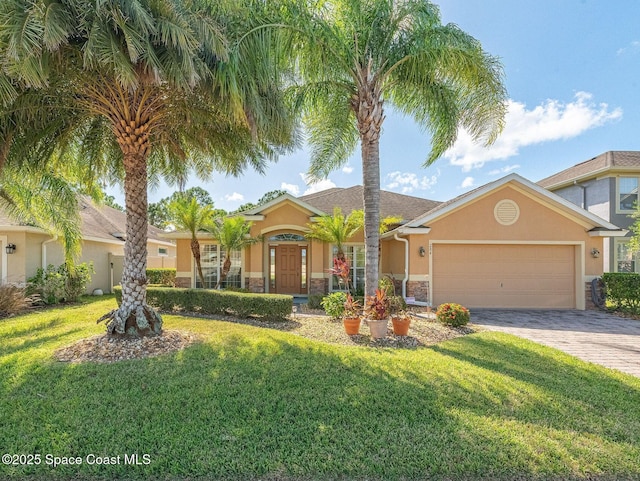 ranch-style house with a garage, a front lawn, stone siding, stucco siding, and driveway