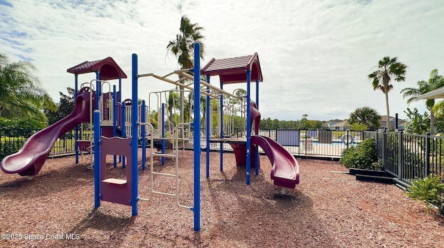 community jungle gym featuring fence