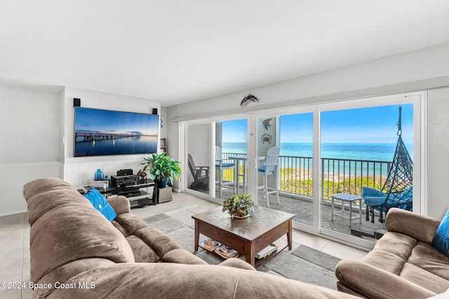 2207 Atlantic St Unit 825, Melbourne Beach, FL 32951 - living area with tile patterned flooring and a wainscoted wall