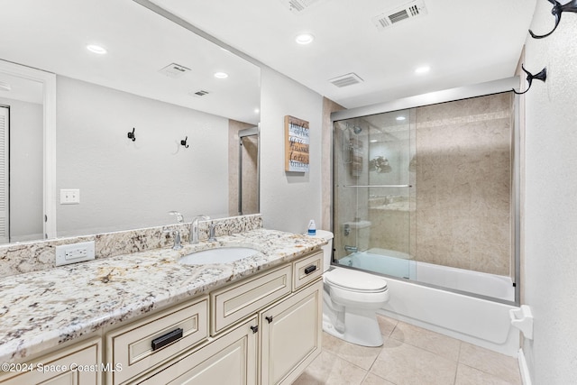 2207 Atlantic St Unit 825, Melbourne Beach, FL 32951 - full bath with toilet, vanity, visible vents, tile patterned flooring, and bath / shower combo with glass door