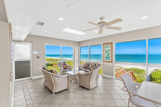 2207 Atlantic St Unit 825, Melbourne Beach, FL 32951 - dining space with a water view, baseboards, a ceiling fan, and visible vents