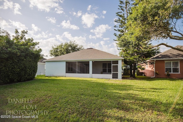 1110 8th Pl, Vero Beach, FL 32960 - back of property featuring a yard, roof with shingles, and a sunroom
