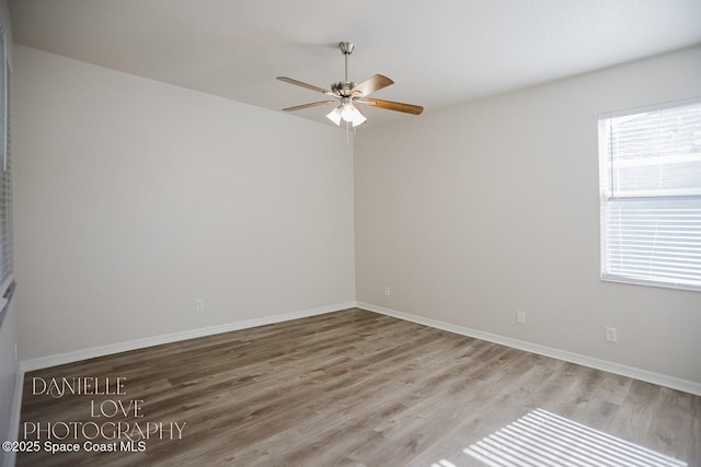 1110 8th Pl, Vero Beach, FL 32960 - unfurnished room with baseboards, a ceiling fan, and wood finished floors