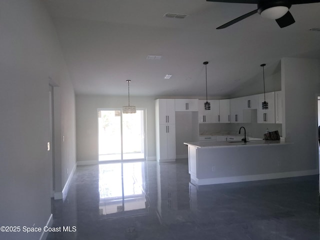 411 La Coco St SW, Palm Bay, FL 32908 - kitchen featuring a sink, a ceiling fan, white cabinetry, baseboards, and decorative light fixtures
