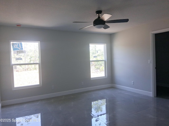 411 La Coco St SW, Palm Bay, FL 32908 - empty room featuring baseboards and ceiling fan