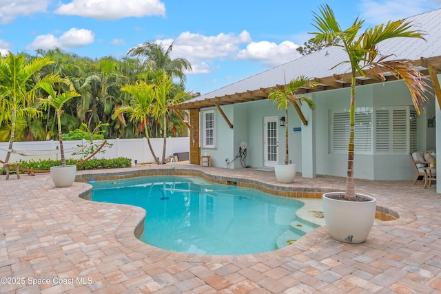 view of swimming pool featuring a fenced backyard, a patio area, and a fenced in pool