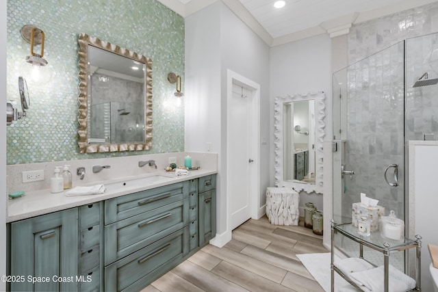 full bathroom with vanity, wood finish floors, and a shower stall