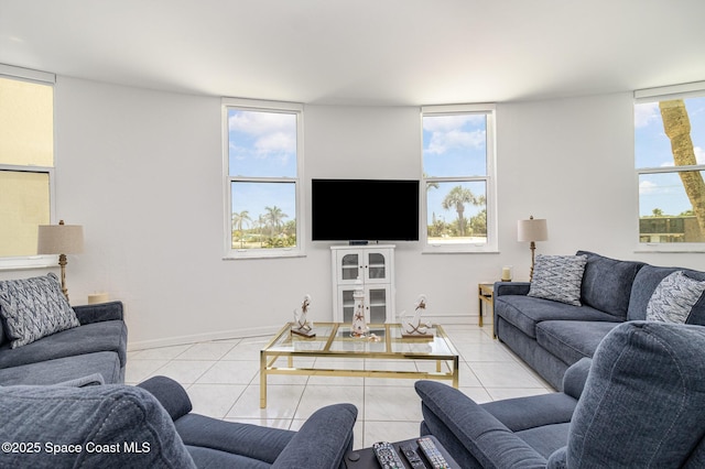 living room with tile patterned floors and baseboards