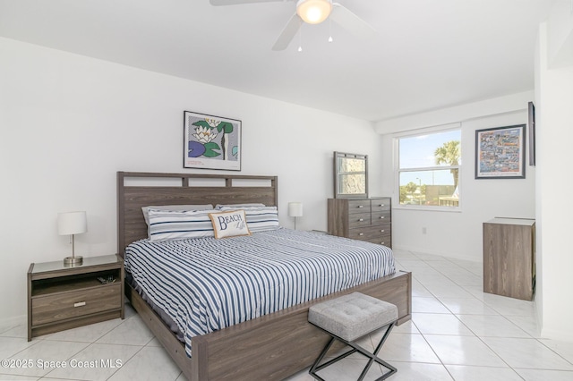 bedroom with light tile patterned flooring, baseboards, and a ceiling fan