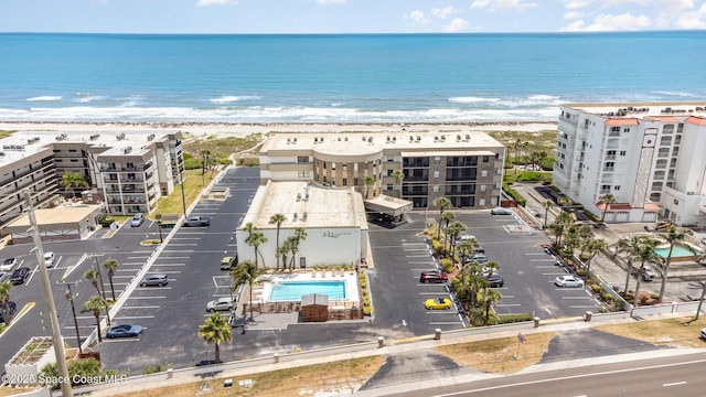 bird's eye view with a water view and a view of the beach