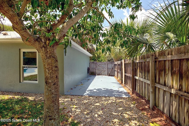 fenced backyard with a patio