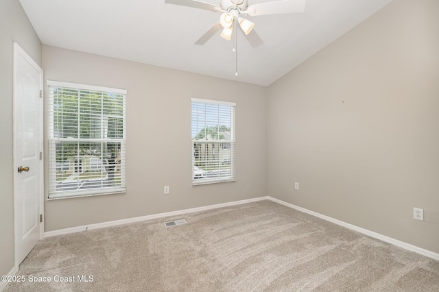 empty room featuring baseboards, visible vents, and carpet