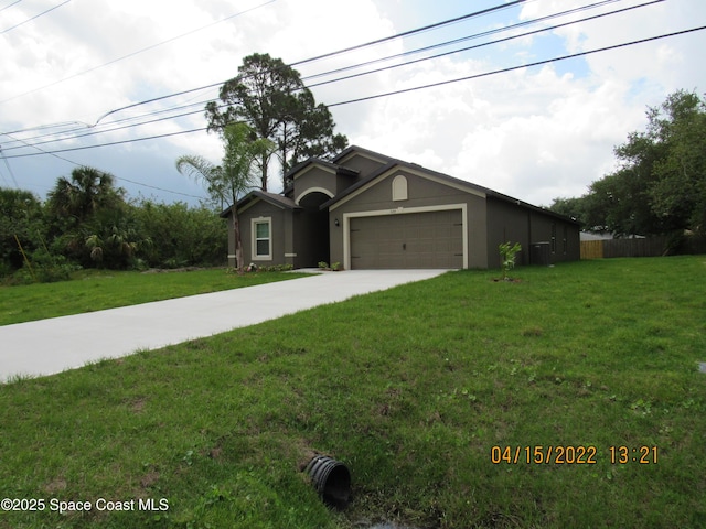 single story home featuring concrete driveway, stucco siding, a front lawn, and an attached garage