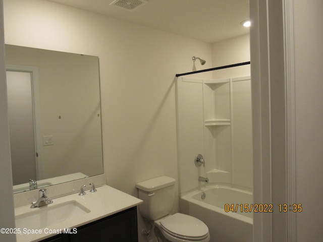bathroom featuring toilet, bathtub / shower combination, vanity, and visible vents