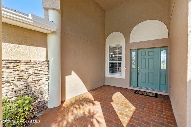 5770 Mascaro Ct, Melbourne, FL 32940 - entrance to property featuring stone siding and stucco siding