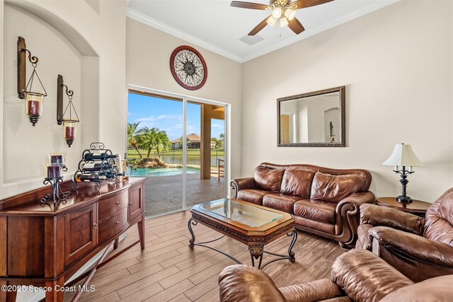5770 Mascaro Ct, Melbourne, FL 32940 - living area with ceiling fan, crown molding, and light wood-style floors