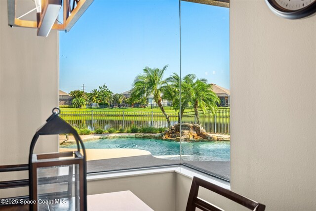 5770 Mascaro Ct, Melbourne, FL 32940 - view of swimming pool featuring a water view and a fenced backyard