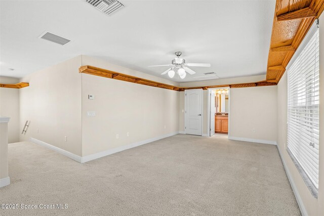 5770 Mascaro Ct, Melbourne, FL 32940 - empty room featuring light colored carpet, healthy amount of natural light, ceiling fan, and baseboards