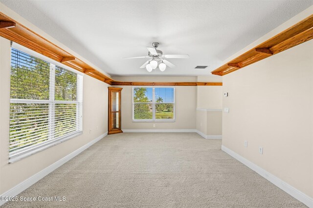 5770 Mascaro Ct, Melbourne, FL 32940 - spare room featuring ceiling fan, light colored carpet, and baseboards