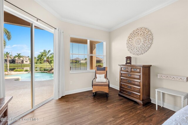 5770 Mascaro Ct, Melbourne, FL 32940 - living area featuring dark wood-style flooring, crown molding, baseboards, and a water view