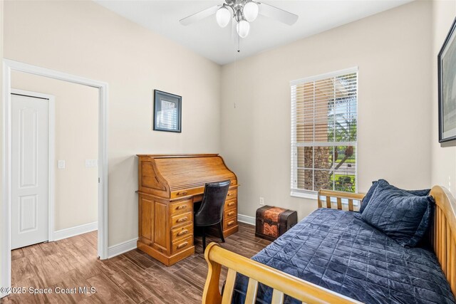 5770 Mascaro Ct, Melbourne, FL 32940 - bedroom featuring wood finished floors, baseboards, and ceiling fan