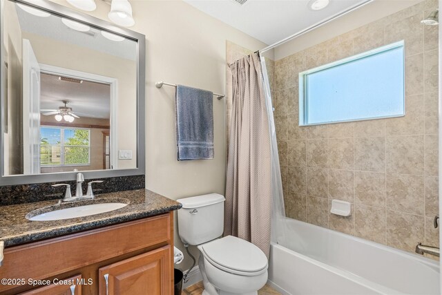 5770 Mascaro Ct, Melbourne, FL 32940 - bathroom with vanity, shower / bath combination with curtain, toilet, and ceiling fan